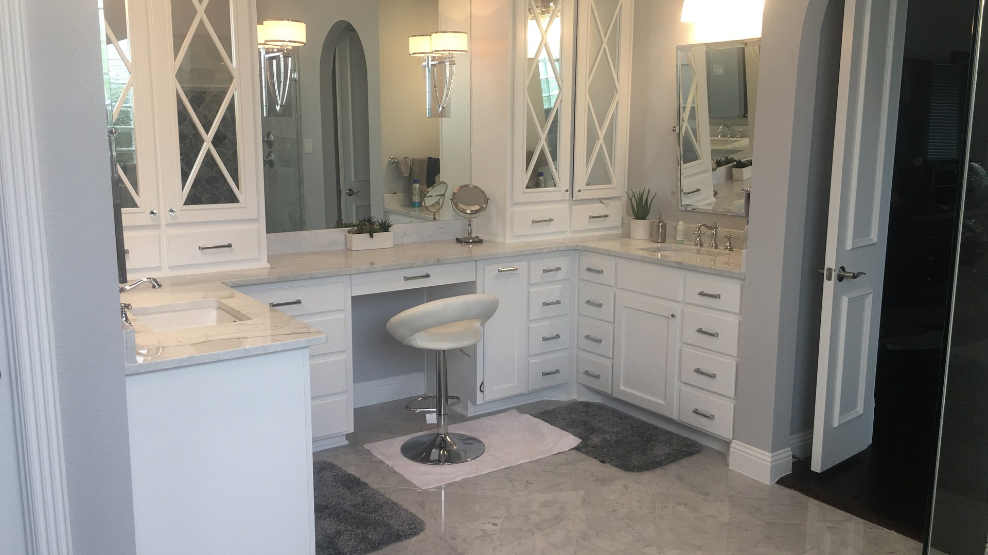Bright kitchen and living space with a custom island, white cabinetry, and natural light from a Venado Construction whole-home remodel